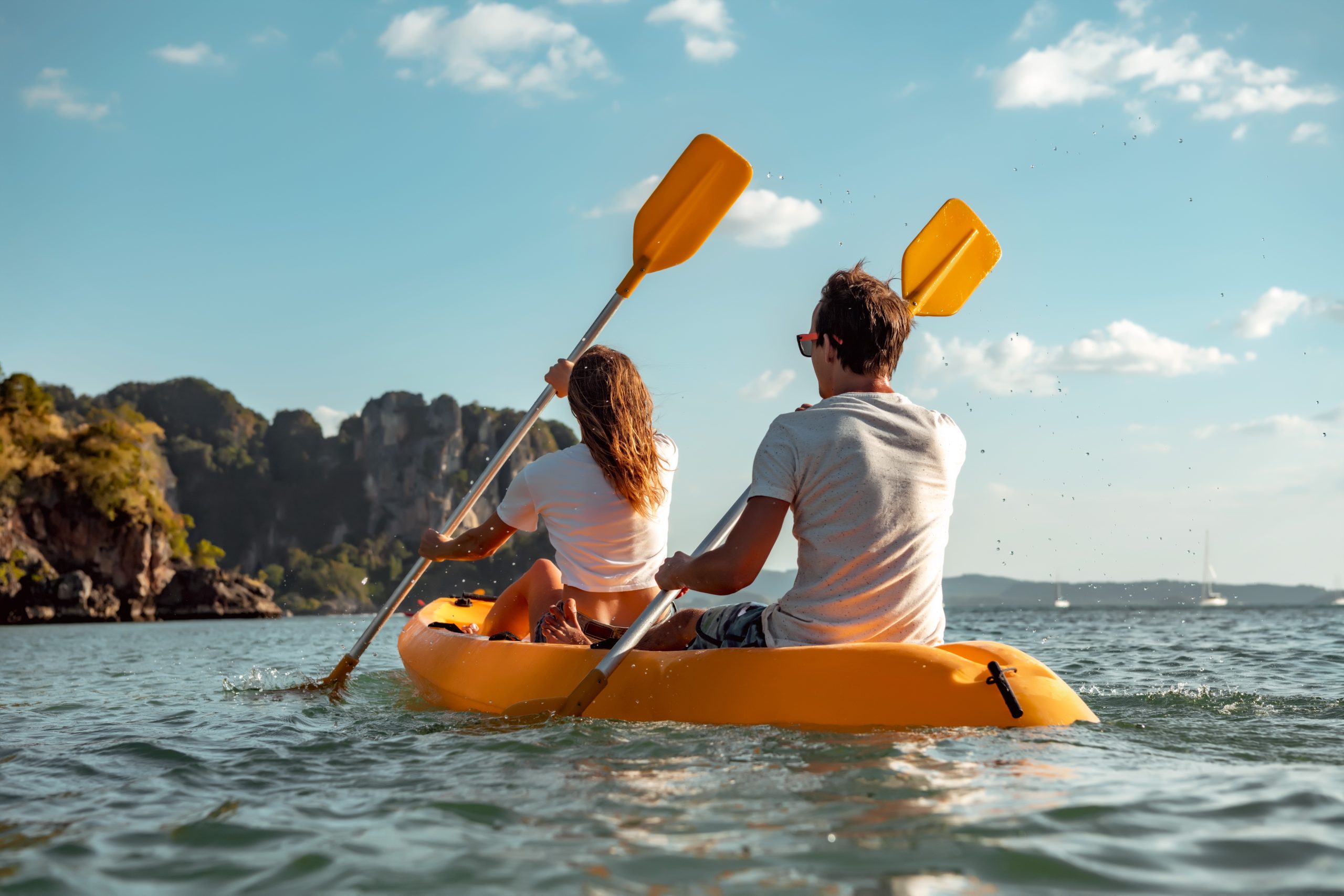 Sea kayakers near some cliffs