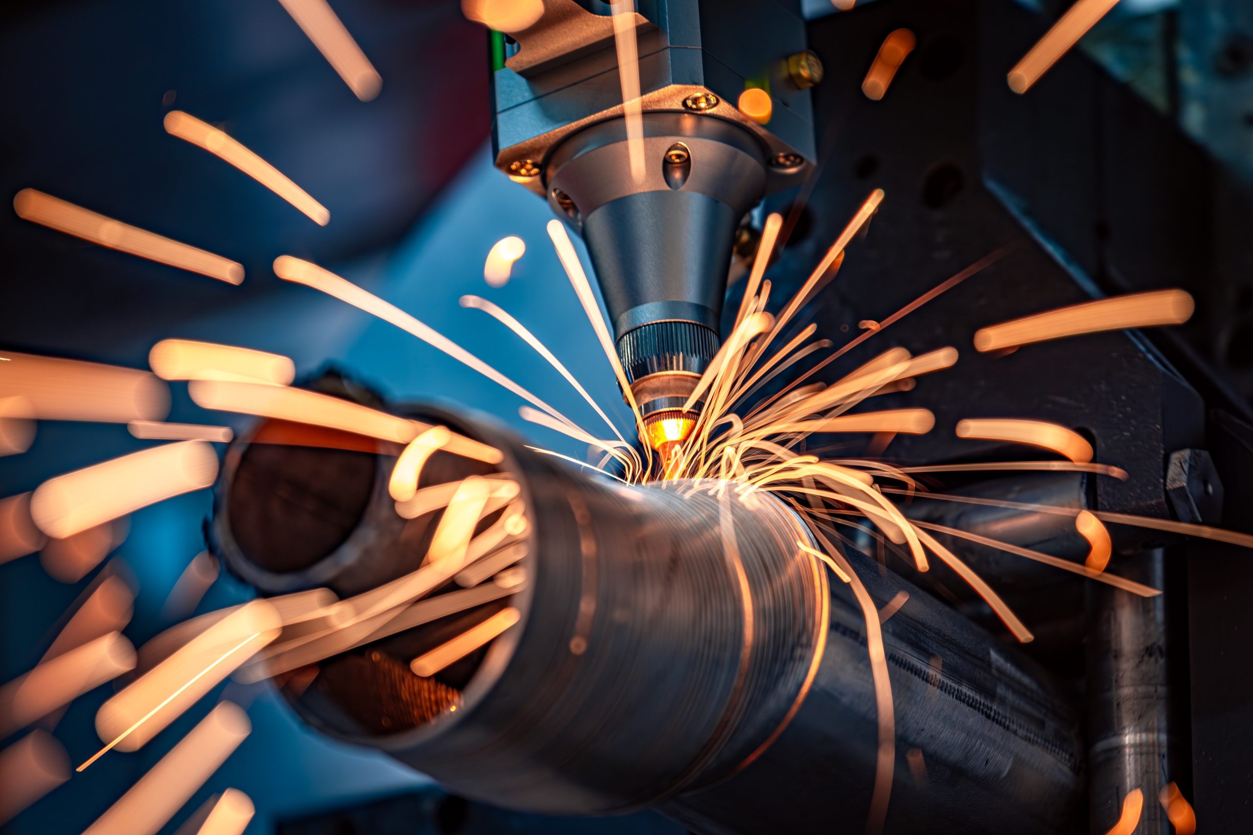 Laser-cutting of metal pipes on a production line